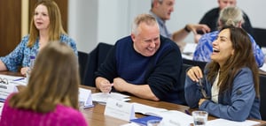 Some attendees talking and laughing at a Strengthify workshop