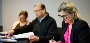 Workshop attendees filling out their workbooks