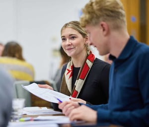 Two attendees at a Discovery Workshop discussing their strengths