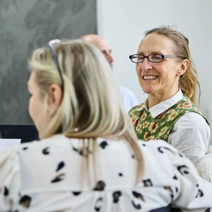 Two women talking to each other at a Discovery Workshop
