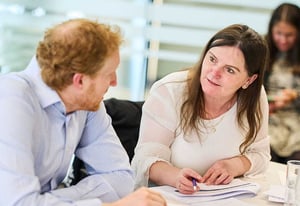A man and woman discussing Strengthify
