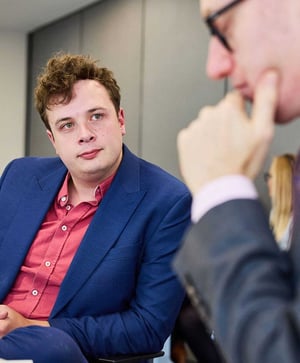 Two health care professionals talking at a workshop