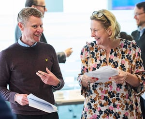 Two attendees discussing their Strengthify profiles