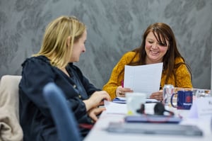 Two team members from South Gloucestershire and Stroud College reviewing their strengths during a Strengthify workshop, reflecting on how their talents contribute to team success.