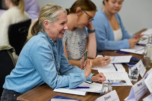 A diverse team engaged in open discussion, fostering psychological safety and trust.